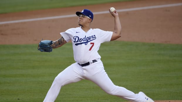 Aug 13, 2020; Los Angeles, California, USA; Los Angeles Dodgers relief pitcher Julio Urias (7) delivers a pitch during the first inning against the San Diego Padres at Dodger Stadium. Mandatory Credit: Kelvin Kuo-USA TODAY Sports